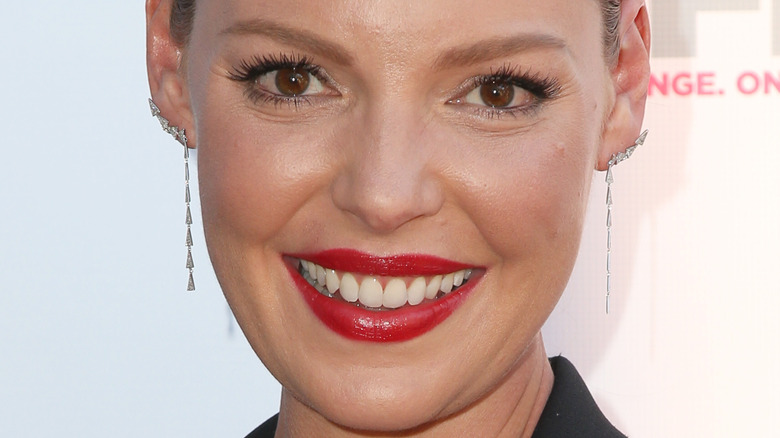 Katherine Heigl smiles in red lipstick