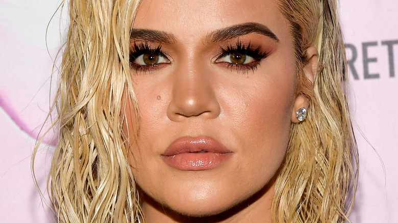 Khloe Kardashian wearing earrings