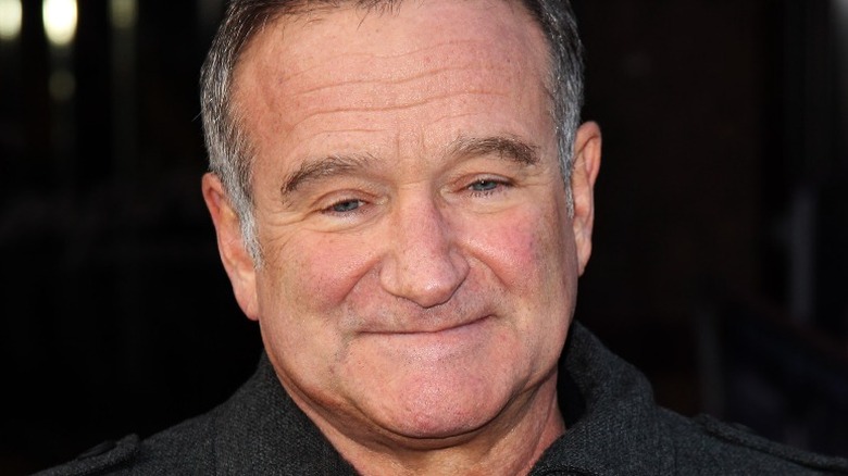 Robin Williams smiling faintly
