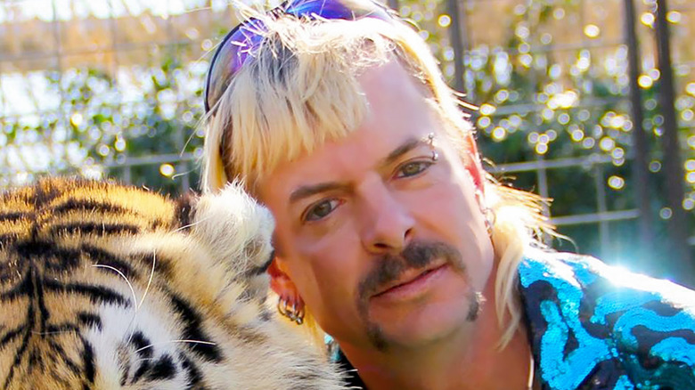 Joe Exotic posing with a tiger