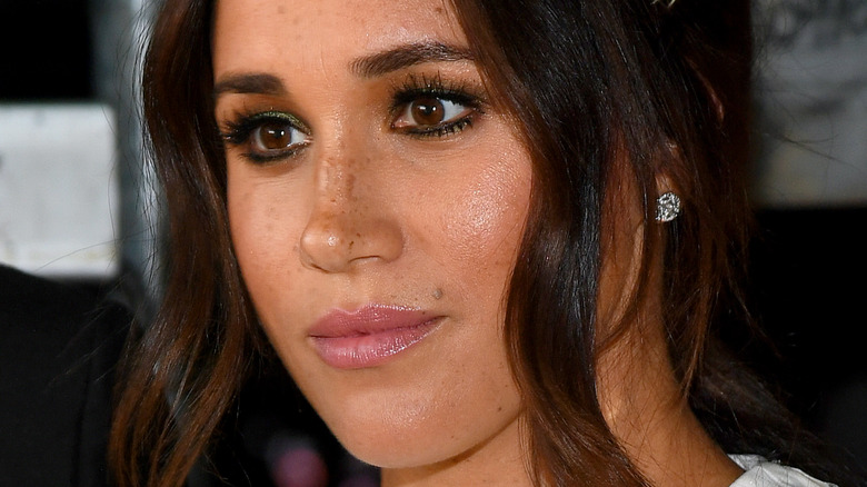 Meghan Markle gives a stern look at an outing