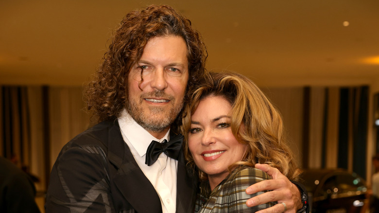 Frédéric Thiébaud and Shania Twain hugging.