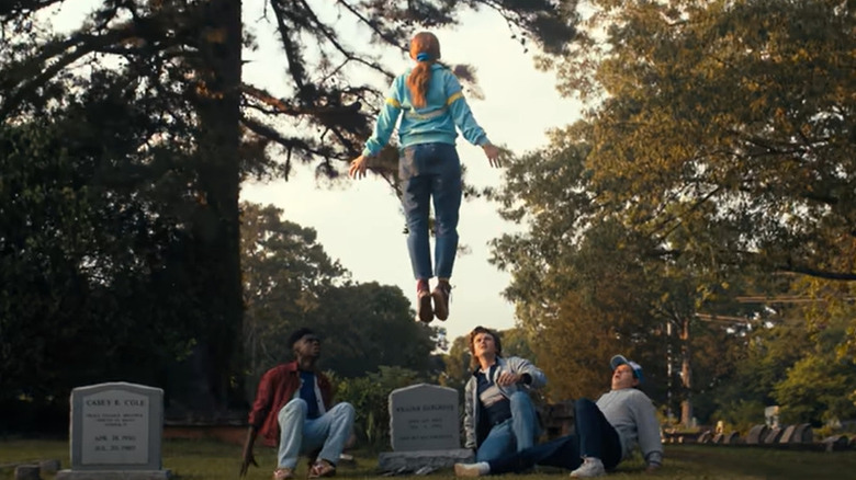 Sadie Sink hovering in cemetery