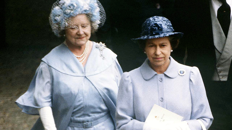 Queen Mother and Queen Elizabeth walking