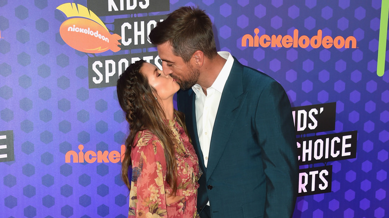 Aaron Rodgers kissing Danica Patrick