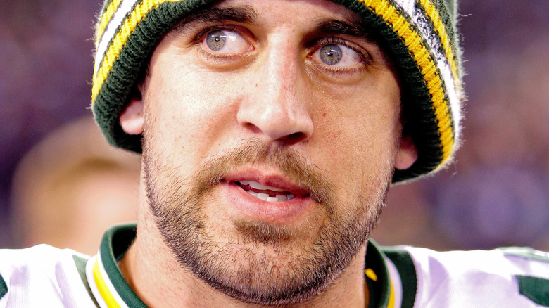 Aaron Rodgers posing on field