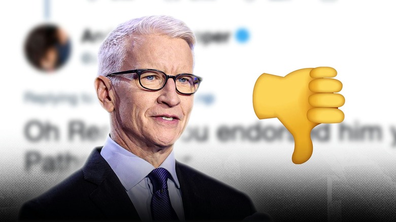 Anderson Cooper next a thumbs down, in front of a tweet