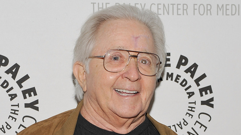 Arte Johnson smiling on step-and-repeat