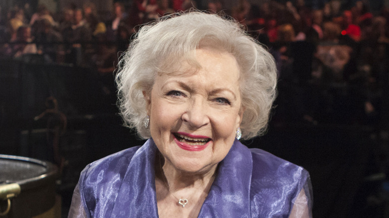 Betty White smiling in front of a crowd