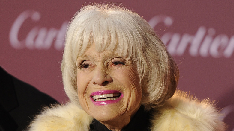 Carol Channing smiling on step-and-repeat