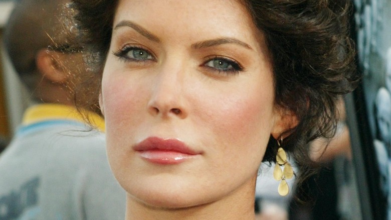 Lara Flynn Boyle poses with raised eyebrow