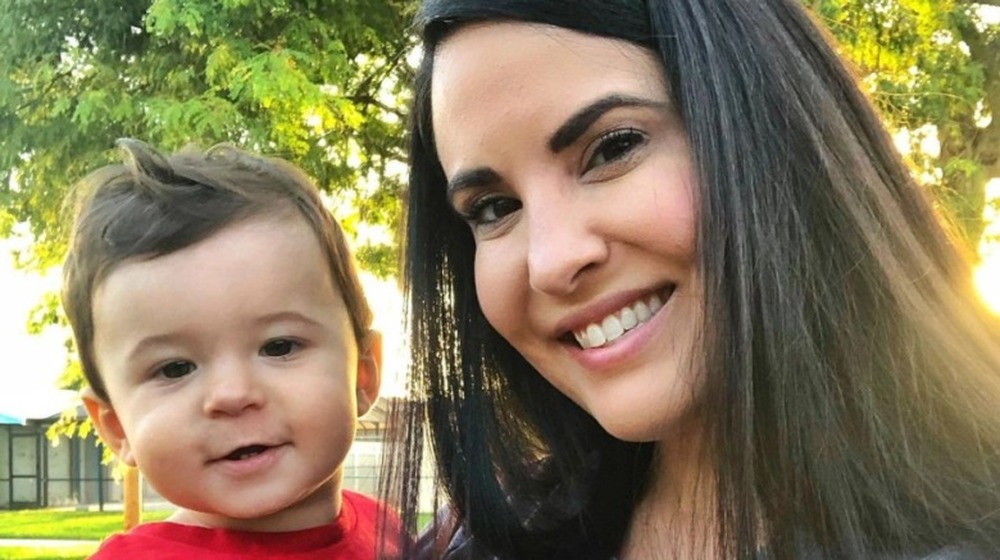 Dr. Jackie Duenas holding her son
