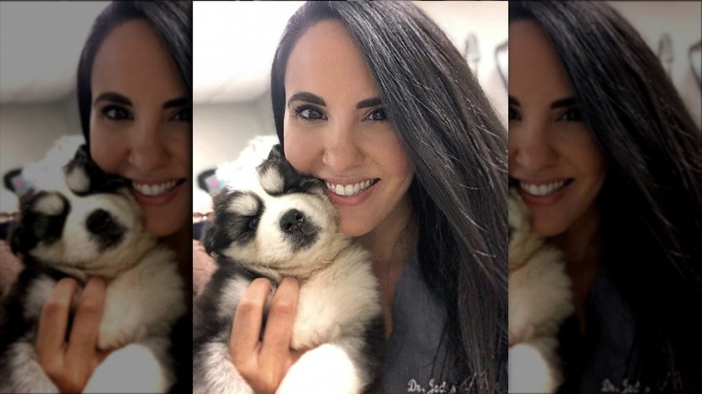 Dr. Jackie Duenas holding her son