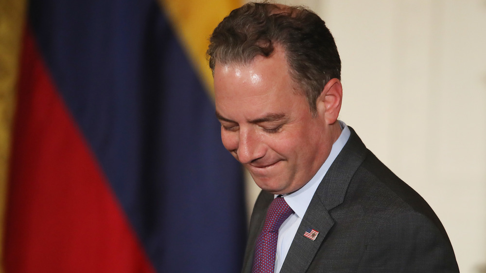 Reince Priebus, smiling and looking down