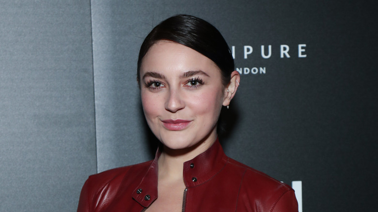Gracie McGraw wearing red jacket