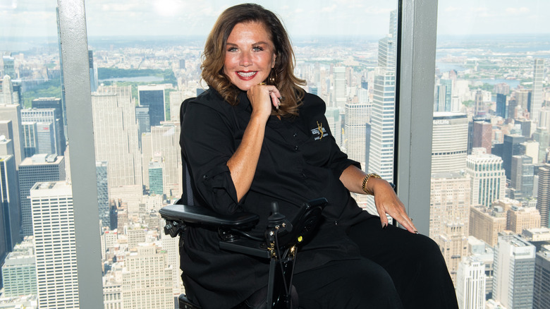 Abby Lee Miller posing in wheelchair