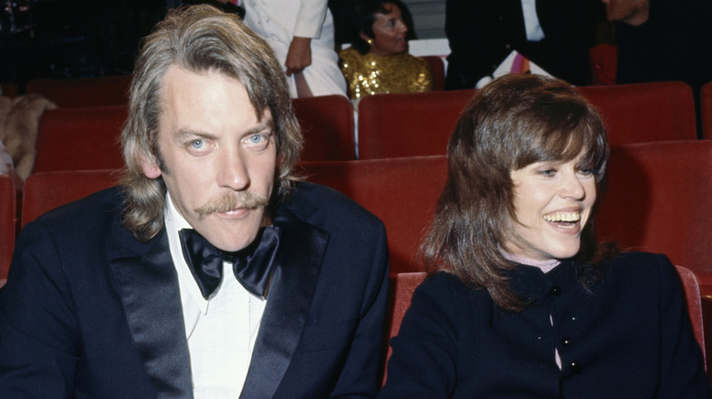 Jane Fonda seated at an award show with Donald Sutherland