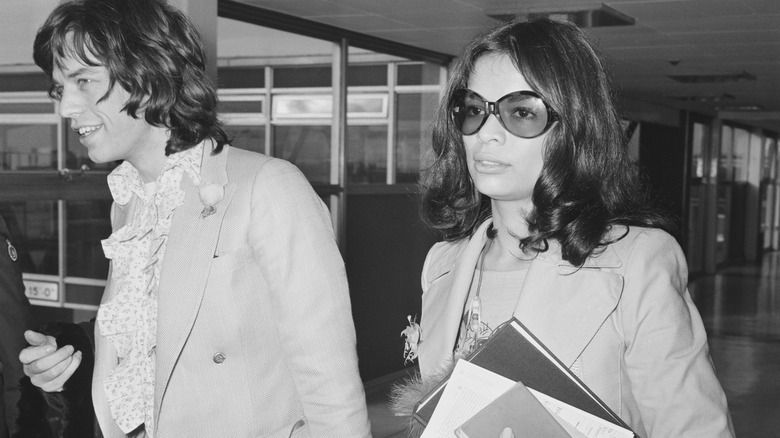 Mick and Bianca Jagger walking