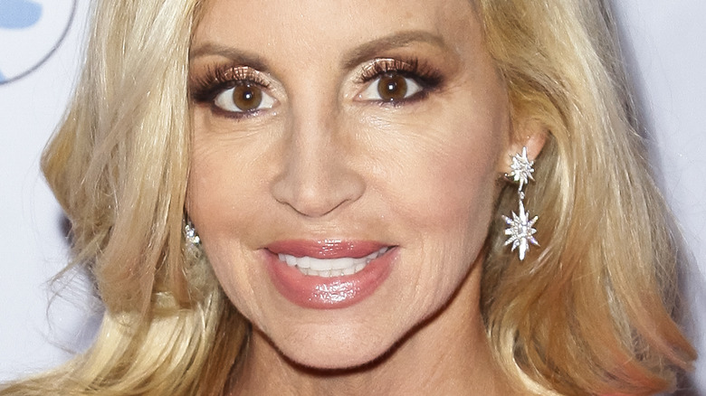 Camille Grammer smiles on a red carpet