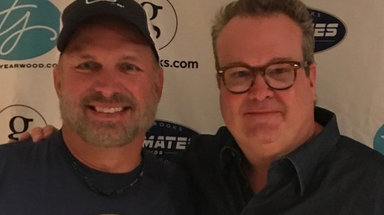 Eric Stonestreet with Garth Brooks  smiling