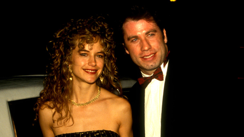 John Travolta and Kelly Preston smile 