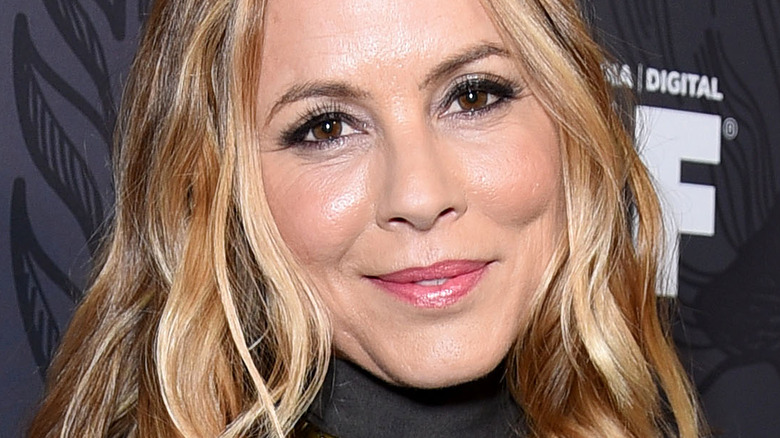 Maria Bello looking at camera with slight smile