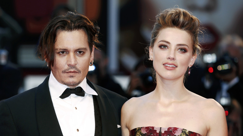 Johnny Depp and Amber Heard posing