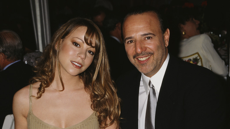 Mariah Carey and Tommy Mottola posing 