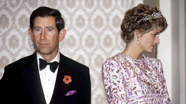 Prince Charles in a tuxedo with Princess Diana, looking off in the other direction