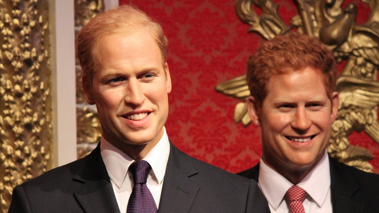 Prince William and Prince Harry wearing suits