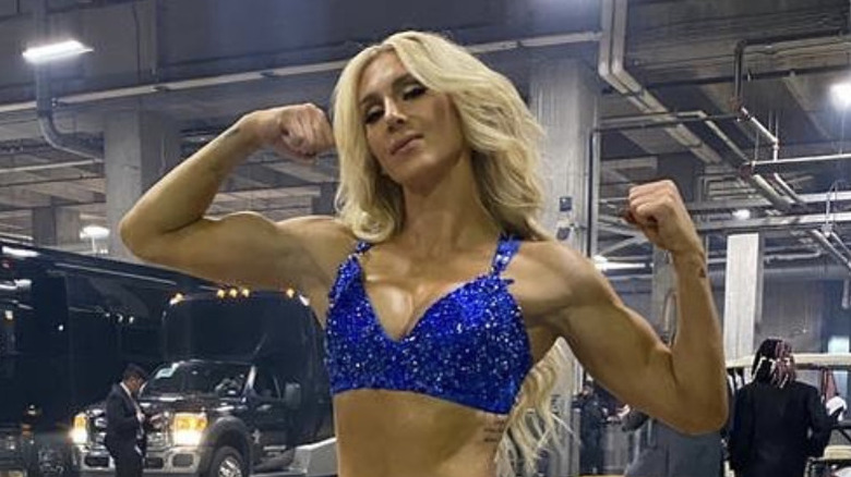 Charlotte Flair showing off muscles