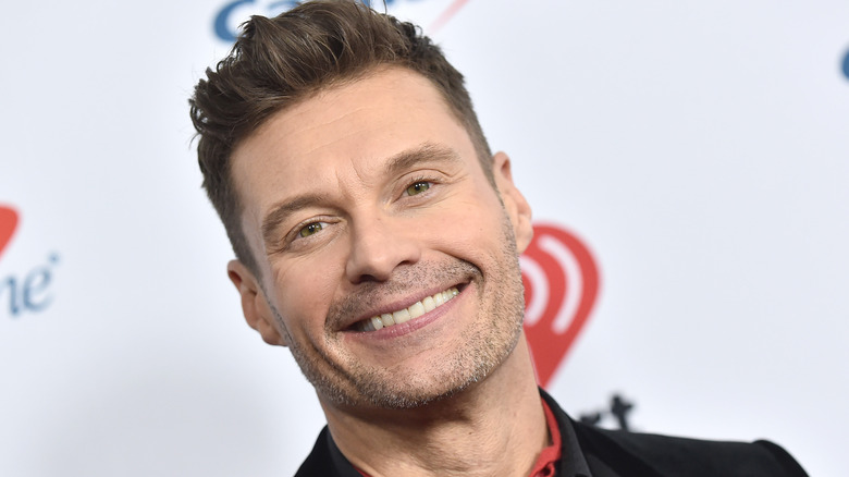Ryan Seacrest grinning
