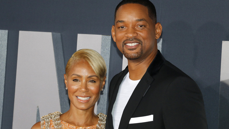 Will Smith and Jada Pinkette smile on red carpet