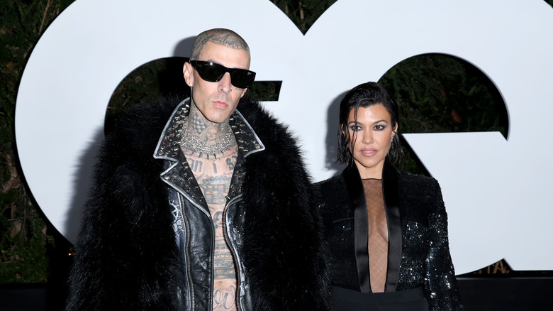 Kourtney Kardashian and Travis Barker posing