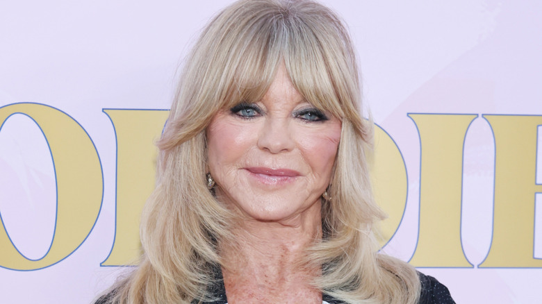 Goldie Hawn poses in a suit