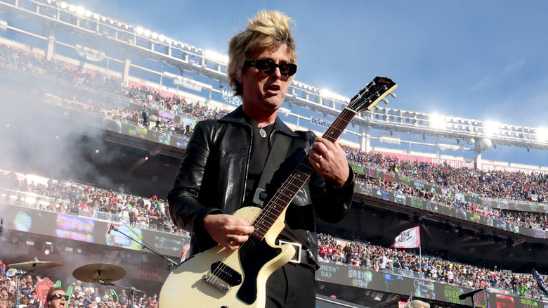 Billie Joe Armstrong playing guitar at the Super Bowl