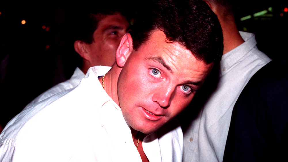 John Wayne Bobbitt in a white shirt.