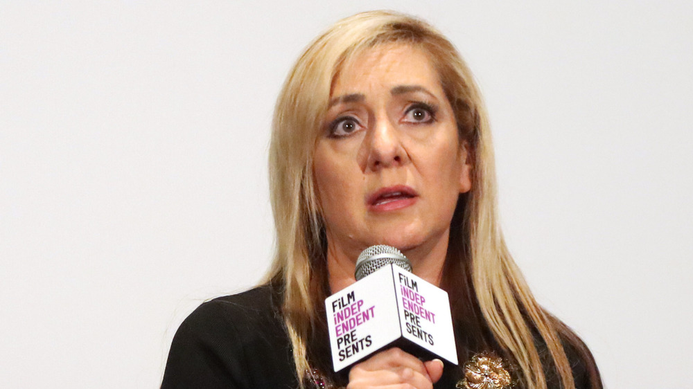 Lorena Bobbitt speaks into a microphone