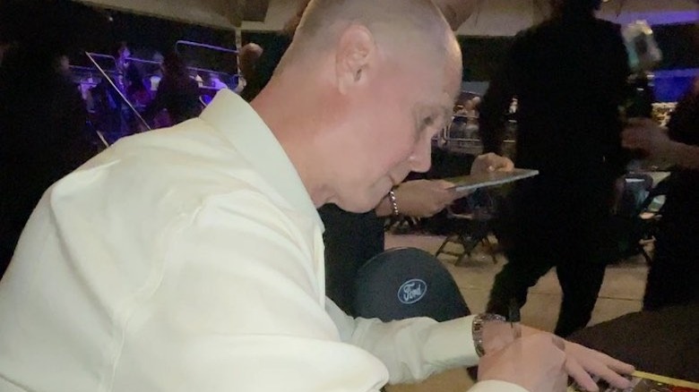 White Boy Rick writing something down