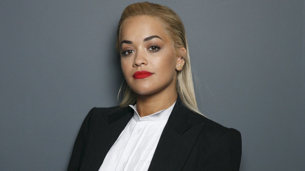 Rita Ora in blazer and white blouse