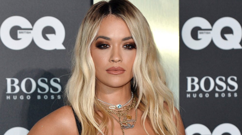 Rita Ora with smokey eyes and lots of necklaces