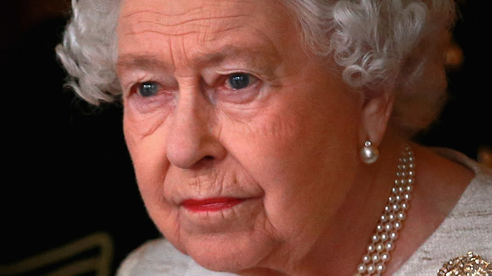 Queen Elizabeth II looking concerned