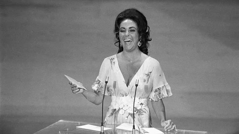 Elizabeth Taylor laughs after the Oscars Streaker incident in 1974