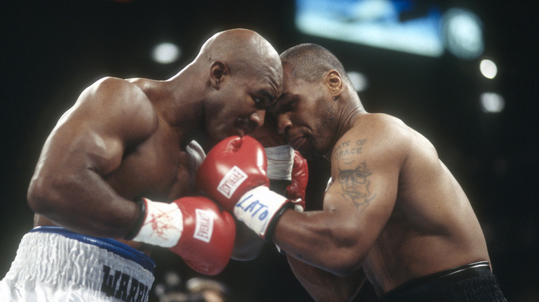 Mke Tyson fighting Evander Holyfield