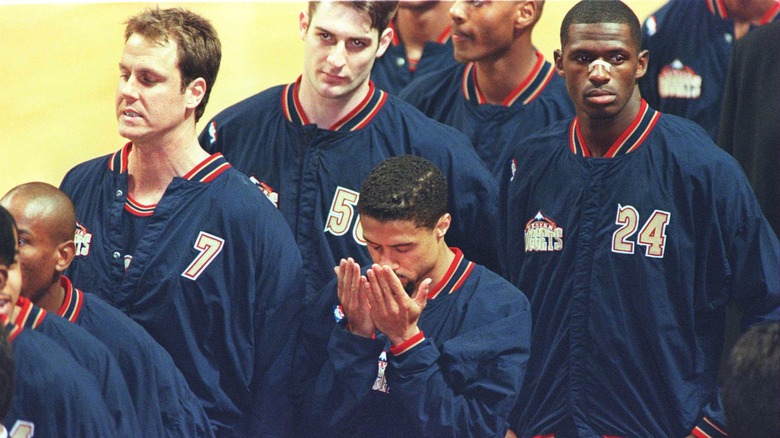 Mahmoud Abdul-Rauf with hands up to his face