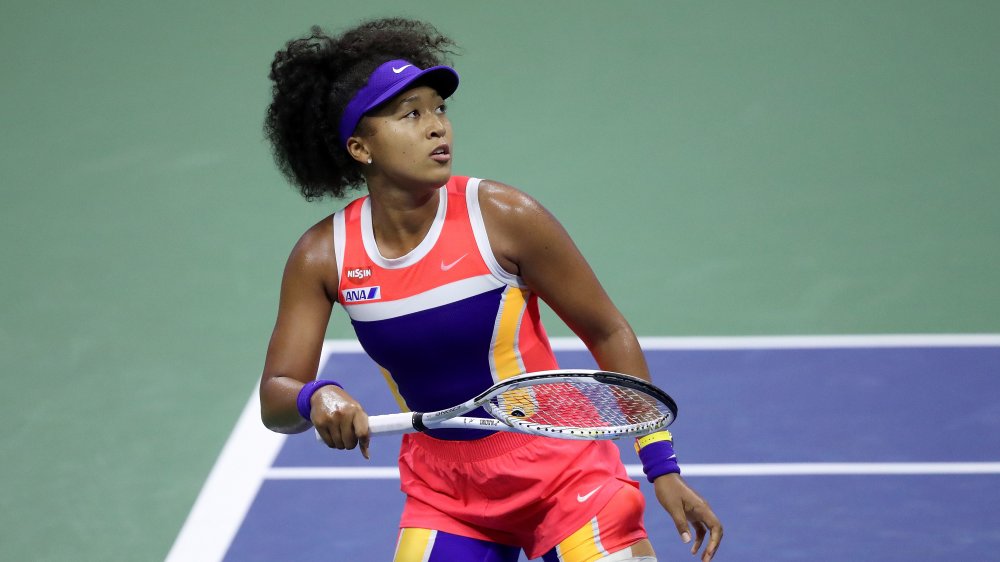 Naomi Osaka on the tennis court, playing