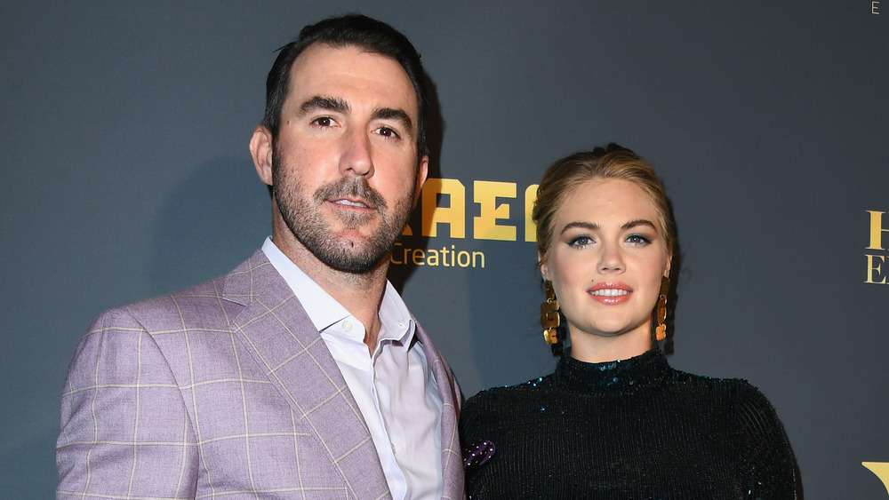 Justin Verlander and Kate Upton posing arm in arm