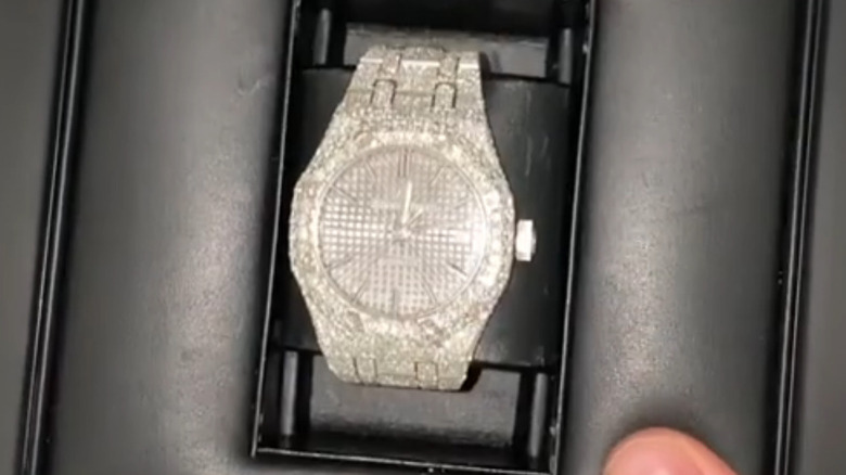 Justin Bieber displays a watch he bought for Hailey Bieber