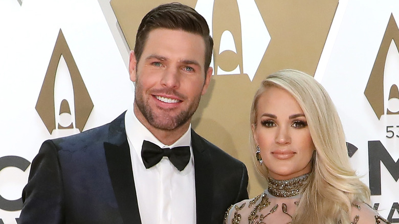 Mike Fisher and Carrie Underwood smiling