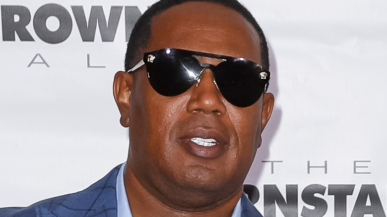 Master P wearing diamond teeth and dark glasses